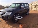 Mitsubishi-SUV-with-toilet-seat-on-the-front-wheel.jpg